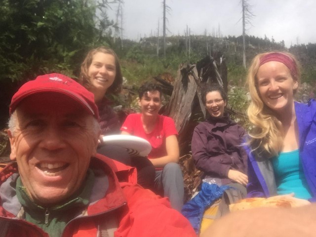 Happy hikers on trail.